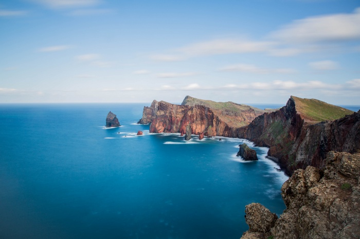 Rocky coastline with blue sea and sky