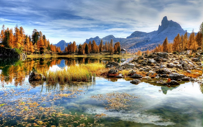 Lake with autumn trees and mountains