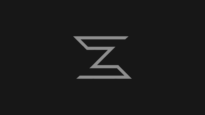 Abstract gray geometric logo on black background