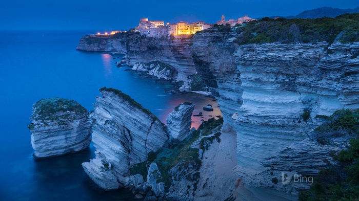 Bonifacio cliffs and town at dusk