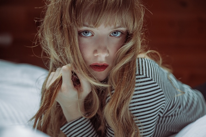 Woman with long blonde hair and blue eyes