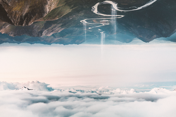 Surreal inverted mountain landscape with waterfalls