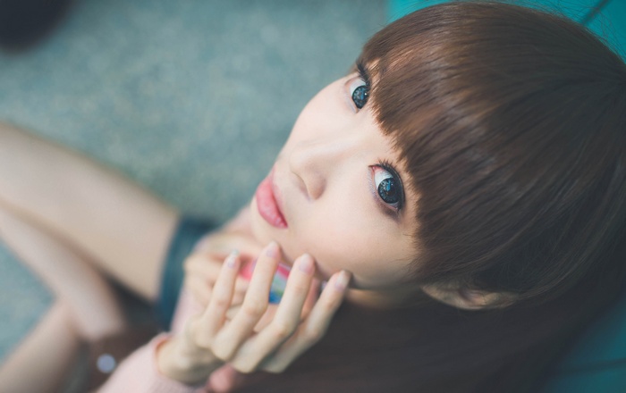 Asian woman with bangs and blue eyes
