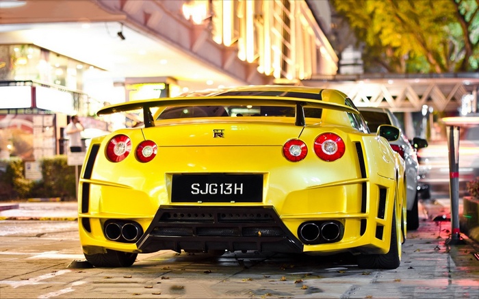 Yellow Nissan GTR with SJG13H license plate