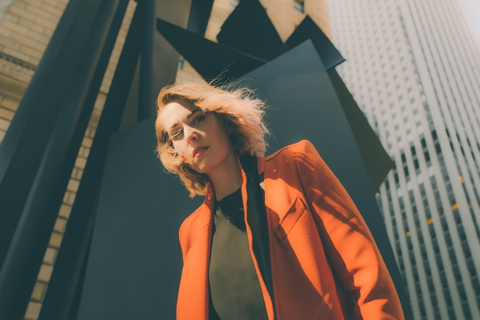 Woman in orange jacket in New York City