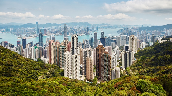 Hong Kong cityscape with lush green hills