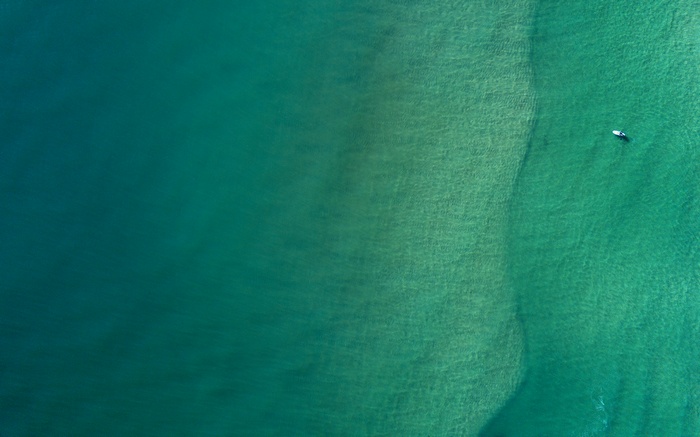 Minimalist aerial view of turquoise ocean water