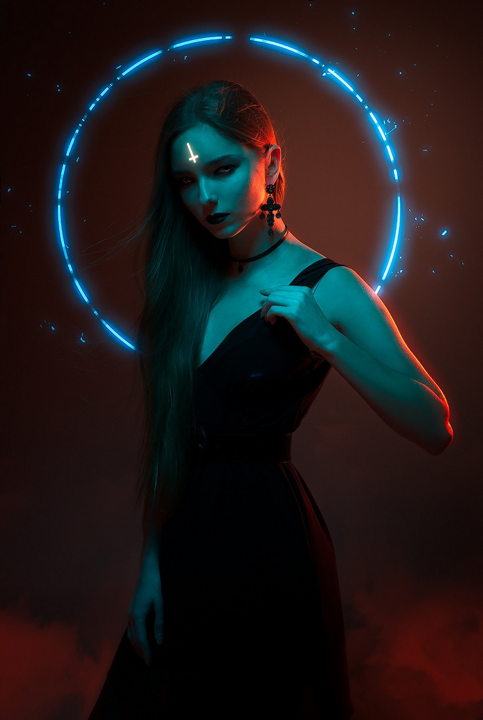 Woman with inverted cross and neon circle