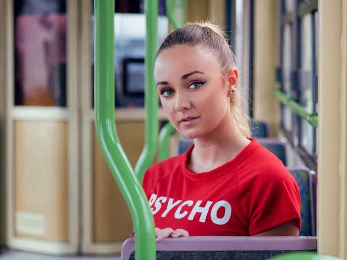 Woman with ponytail wearing a red shirt