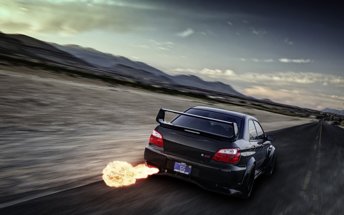 Black Subaru Impreza WRX STi with flames on road