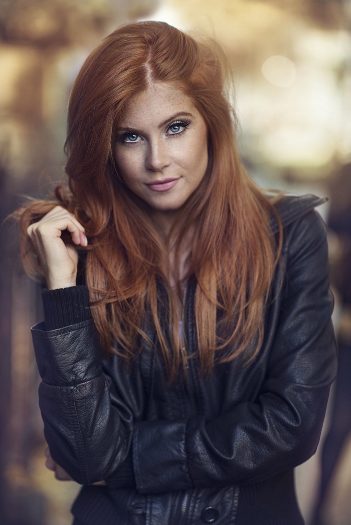 Redhead woman with freckles and blue eyes