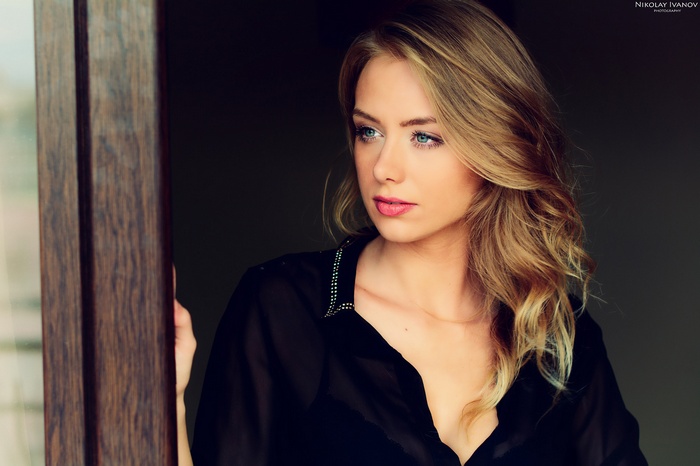 Woman with blonde hair looking away