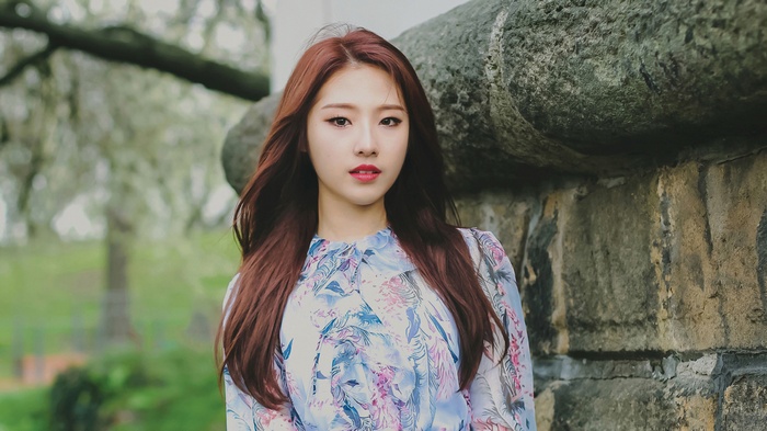 Kim Ji-woo from LOONA in a floral dress outdoors