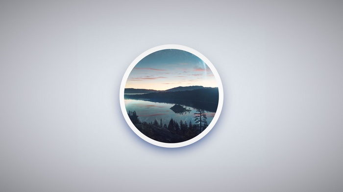 Circular landscape of a lake with mountains at sunset