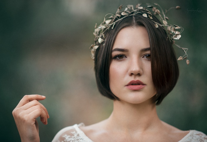 Portrait of a woman with a floral crown