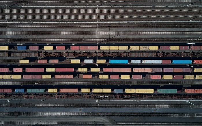 Aerial view of a train yard with cargo containers