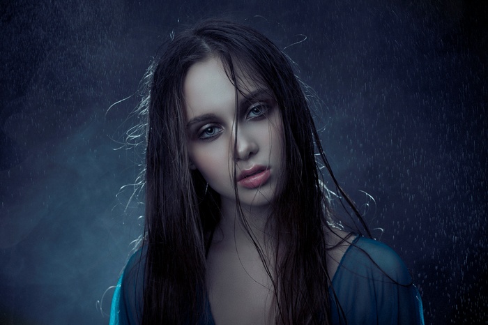 Portrait of a woman with wet hair in the rain