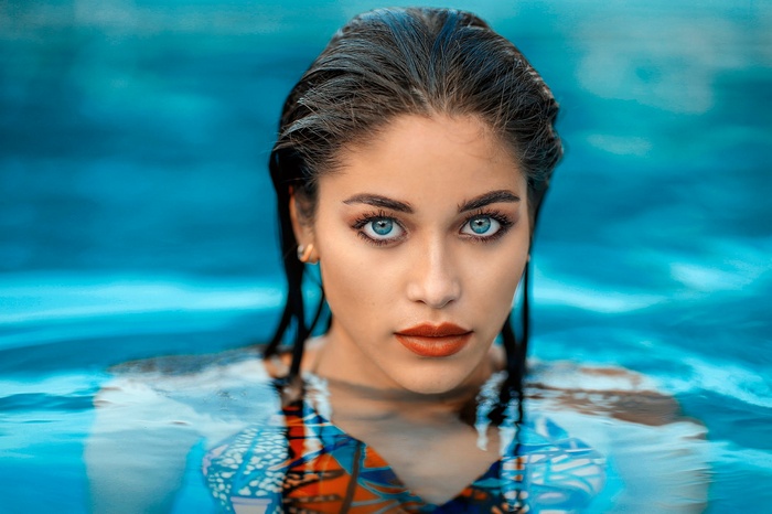 Woman with blue eyes in a swimming pool