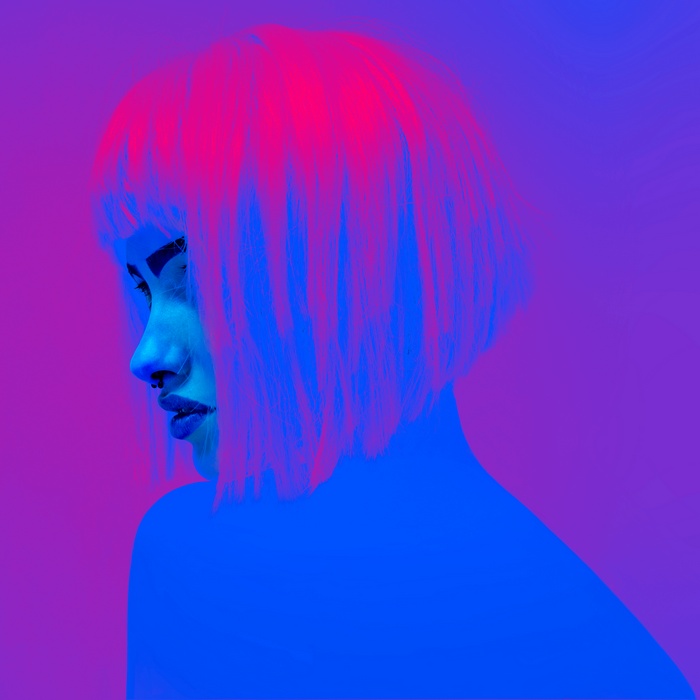 Woman with pink hair and nose ring