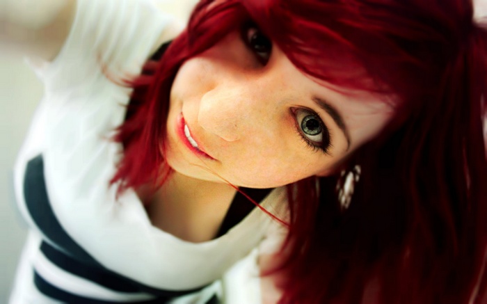 Redhead woman wearing a white sweater