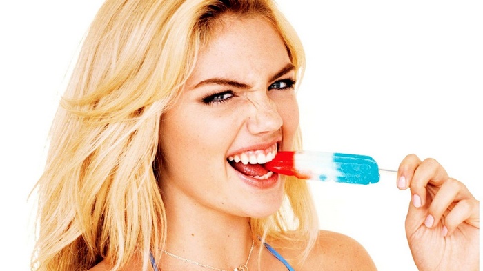 Kate Upton eating a red, white, and blue popsicle