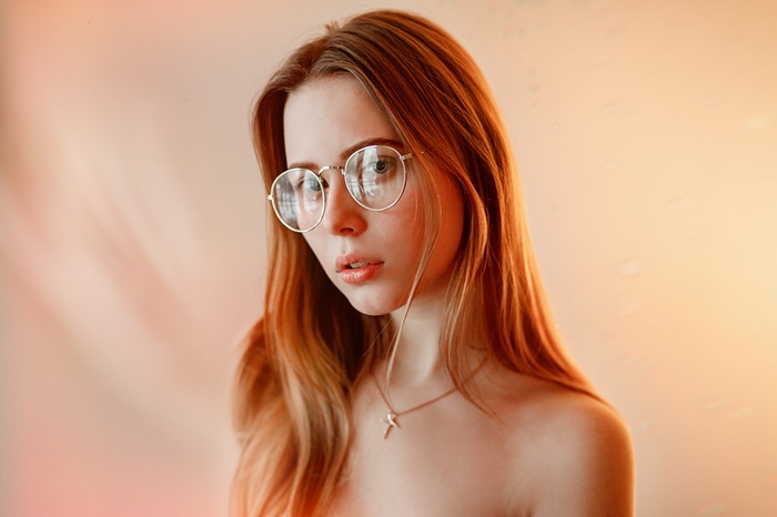 Woman with glasses and necklace