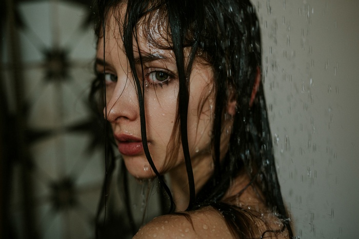Woman with wet hair in the shower