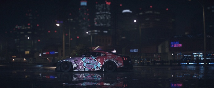 Nissan GTR with "STATUS CROWNED" livery at night