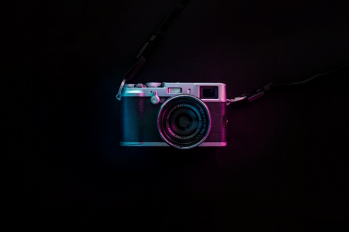 Fujifilm X100V camera with neon lighting