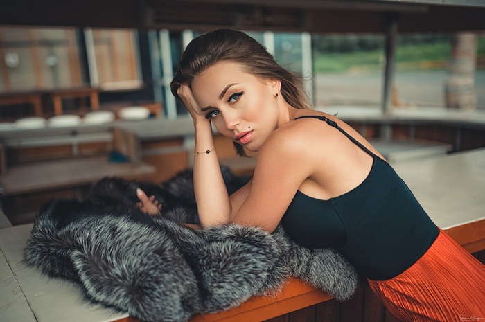 Woman with blue eyes and fur