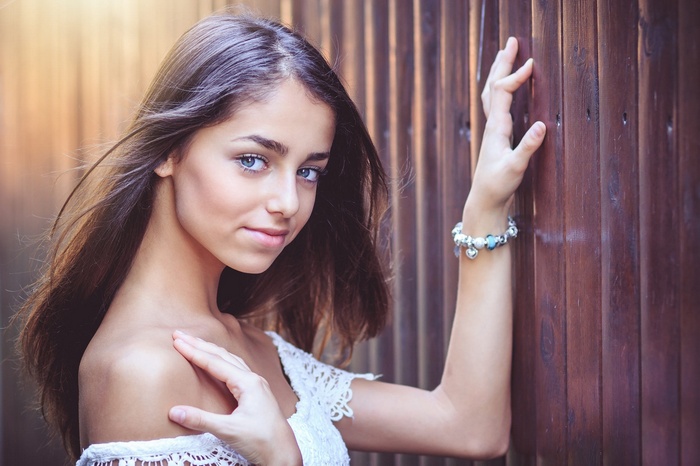 Portrait of a young woman with blue eyes and long hair