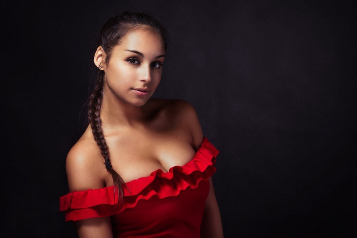 Woman in a red off-the-shoulder dress