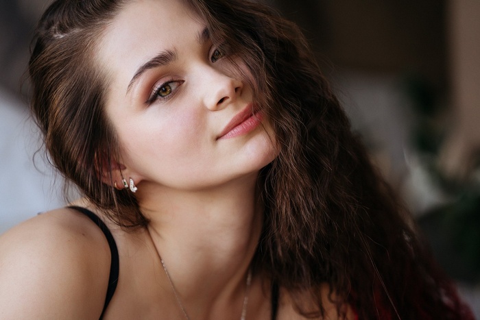 Woman with long brown hair and green eyes