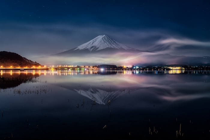 Mount Fuji reflection at night with city lights
