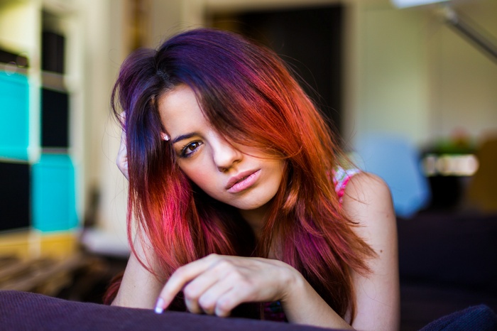 Woman with colorful hair looking at viewer
