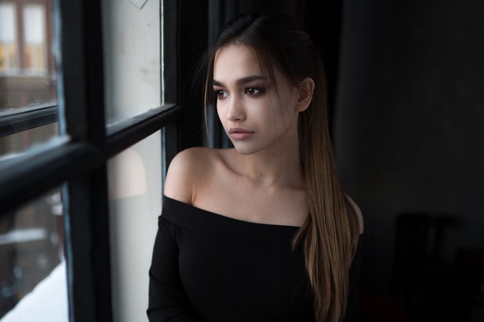 Anastasia Lis by the window