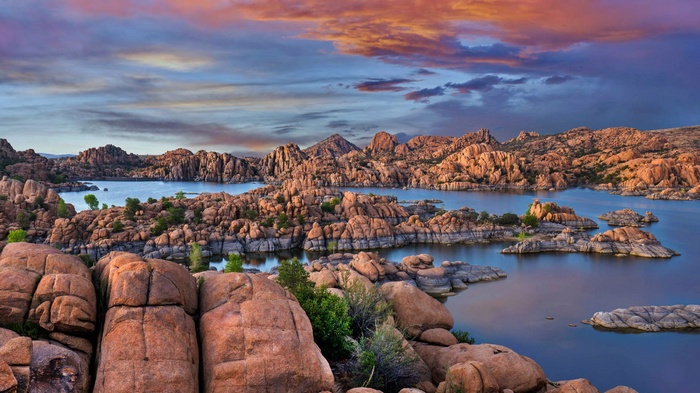 Rocky islands in a lake at sunset