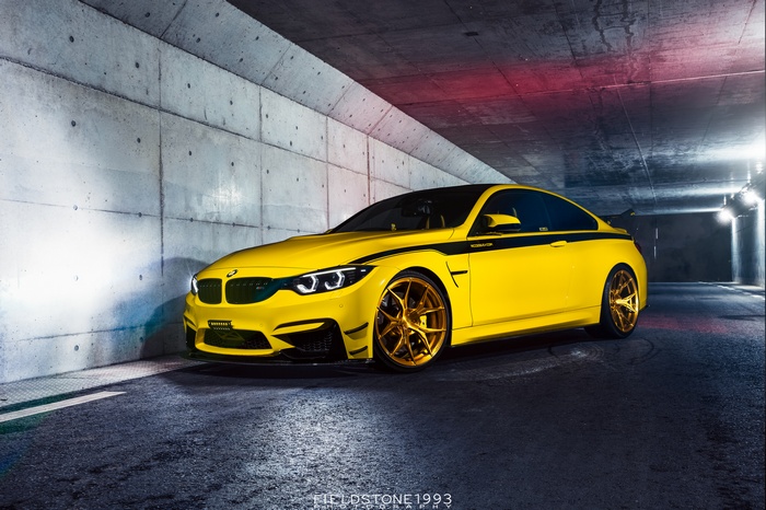 Yellow BMW M4 Coupe with Gold Wheels
