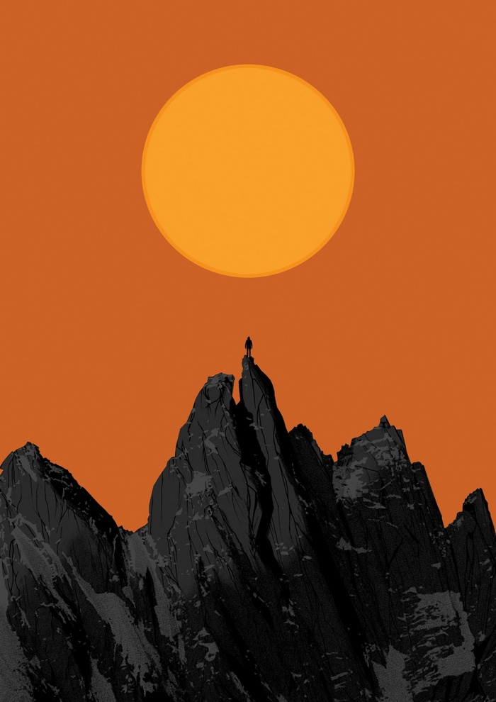 Silhouette on mountain peak under large sun