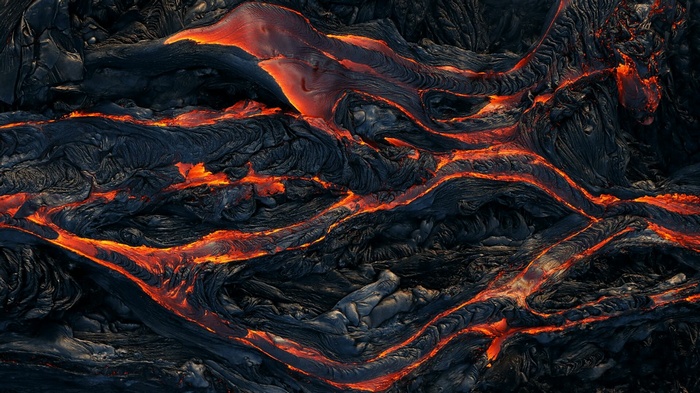Flowing lava with glowing orange cracks