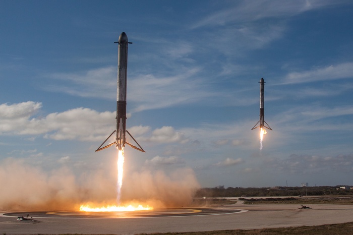Two SpaceX Falcon Heavy rockets landing at Cape Canaveral