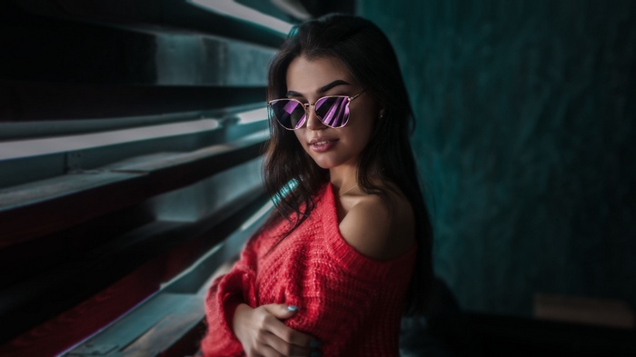 Woman in red sweater and sunglasses