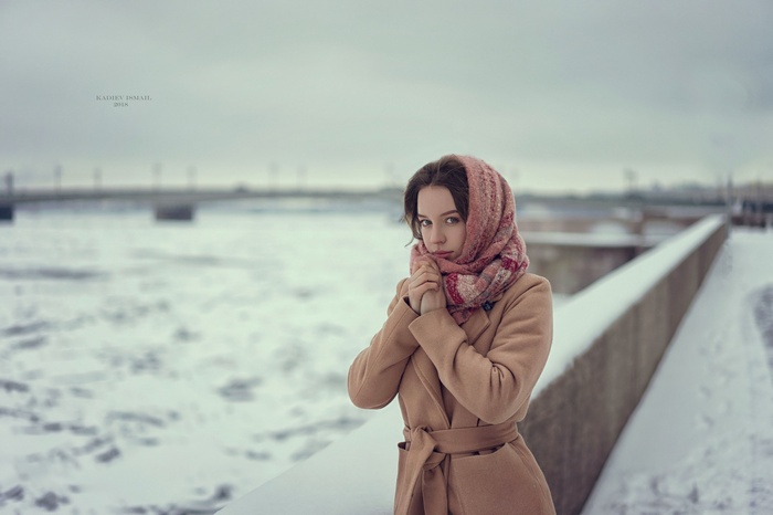 Woman in winter coat and scarf by Kadiev Ismail