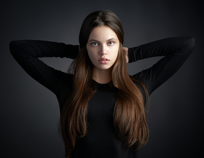 Portrait of a young woman with long brown hair