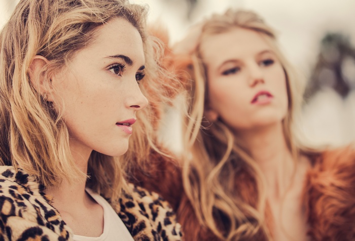 Two blonde women in fur coats