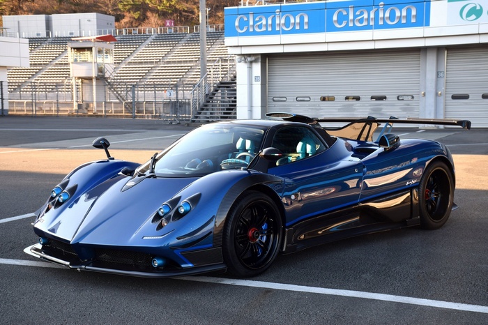 Blue Pagani Zonda sports car on a race track