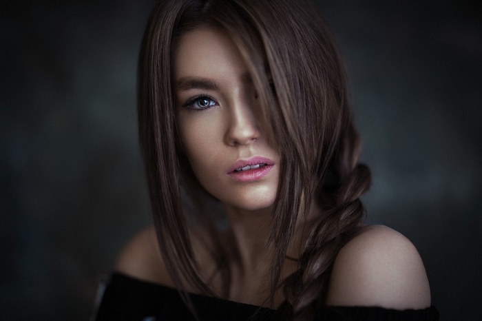 Portrait of a woman with brown hair in a braid