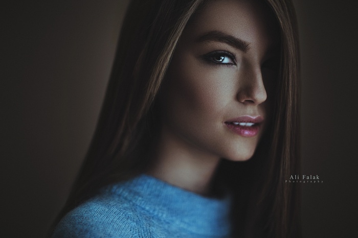 Portrait of a woman with hair in her face