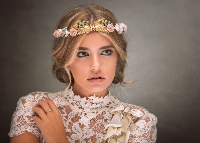 Woman wearing a white lace dress and floral crown