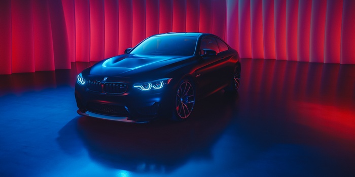 Black BMW M4 Coupe with Blue Headlights